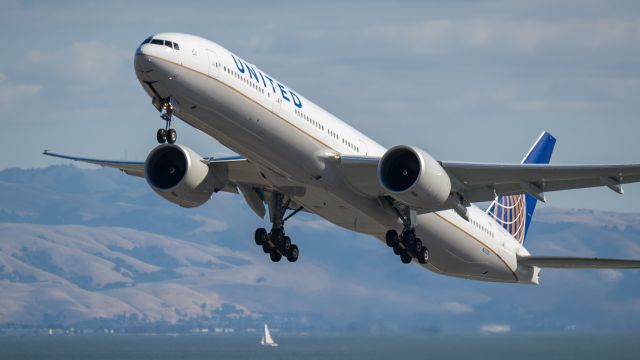 BOEING 777-300 (N2737U) - Departing 28L for Tokyobr /11/5/17