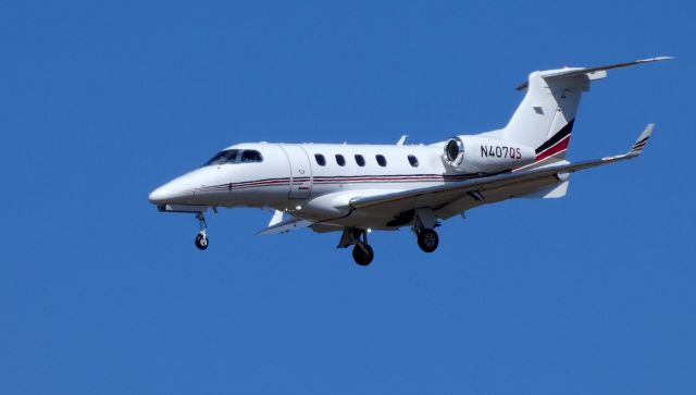 Embraer Phenom 300 (N407QS) - On final is this 2017 Embraer Phenom 300 in the Winter of 2019.