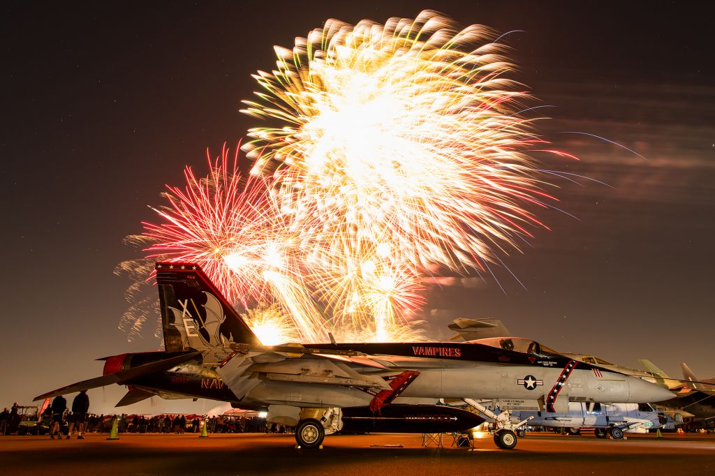 McDonnell Douglas FA-18 Hornet (16-6957) - The stunning CAG bird of the VX-9 Vampires basks in the glow of fireworks at the 2022 Sun N Fun Aerospace Expo!
