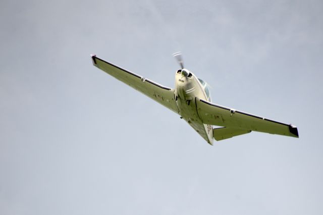 Beechcraft 35 Bonanza (N5316E) - Low Approach at the family farm near Sutton, ND