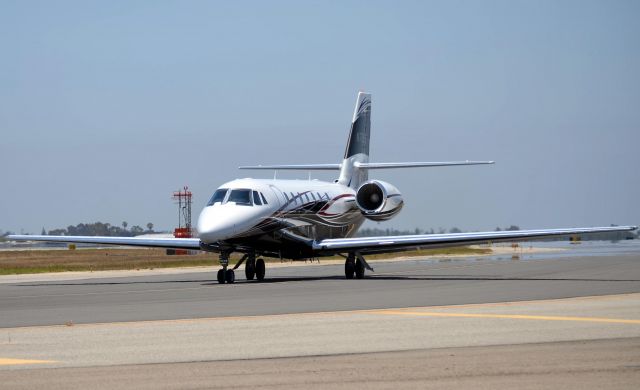 Cessna Citation Sovereign (N715WE) - This Citation was manufactured in 2009 and it is seen just before it taxies onto runway 20R. On this same day I rented a C-172 that had full fuel and a passenger, we took a little over 1,000 feet of runway to takeoff. This Citation with a light load also used just over 1,000 feet which I must say is extremely impressive (Ive never seen a biz jet or any commercial jet for that matter use so little runway) and I do know for sure it was only a little over a thousand for this jet because I could see the "thousand foot markers" from where I was standing so it wasnt just a guess.