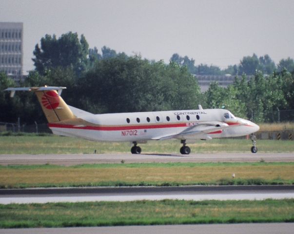 Beechcraft 1900 (N17012) - KDEN - Continental Express headed for the departure runway...