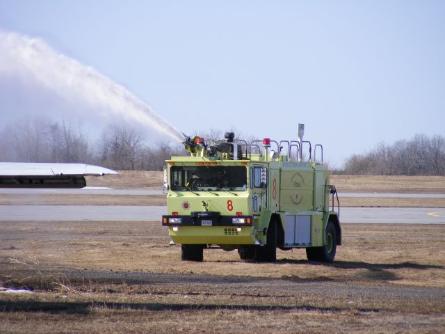 — — - airport fire truck #8 praticing on an old 727, at ottawa.