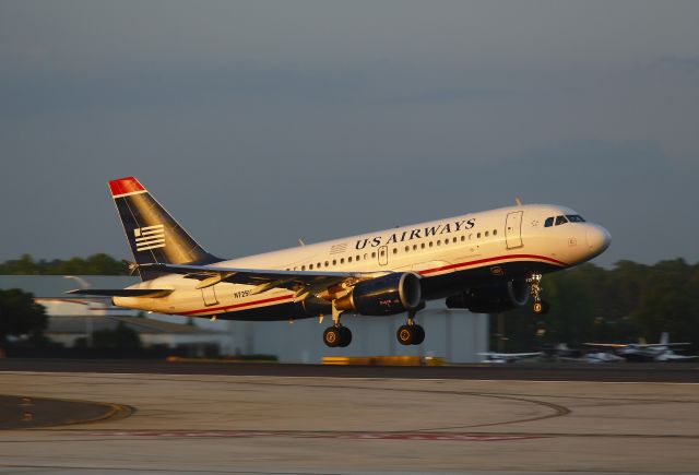 Airbus A319 (N725UW) - This Airbus A319 was taking off at sunset from runway 18L, Charlotte, North Carolina on 31 May 2013