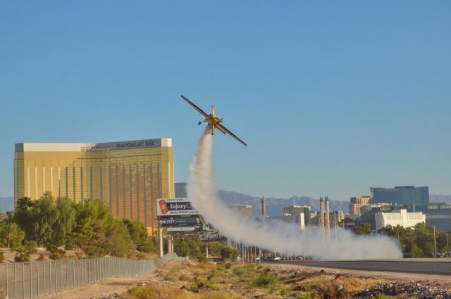 ZIVKO Edge 540 (N423KC) - Kirby Chambliss taking off from the Las Vegas Strip to land on RWY 19L at KLAS:D  Keep an eye out for the commercial!