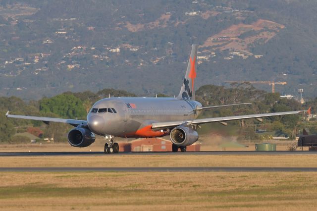 Airbus A320 (VH-VQL) - Turning onto taxiway Foxtrot 4 after landing runway 23. 13 Jan 2020