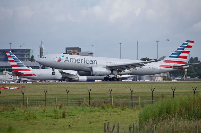 Airbus A330-200 (N282AY) - AAL734 arriving at MAN with N390AA in the background on the AAL210/211 rotation from JFK