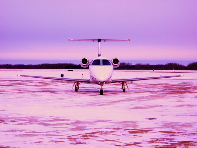 Embraer Phenom 100 (N876JC) - Taken in Bemidji,MN in late December. -22 degrees C.