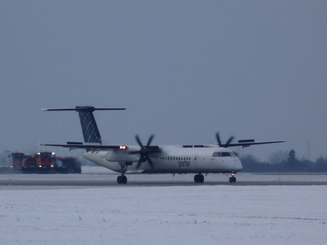 C-GLQQ — - just landed on #07, snow fighting equipment waiting.