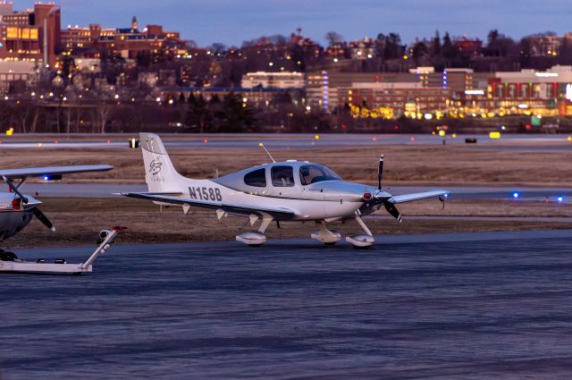 Cirrus SR-22 (N158B) - As seen on MAC Jets ramp during early evening in January. The photo taken from the designated spotting area.
