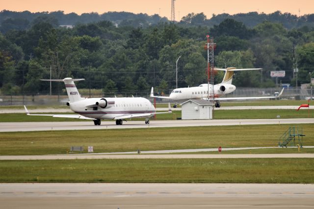 Canadair Regional Jet CRJ-200 (N500PR) - 08-15-21. Two "500" reg # aircraft. N500PR on left, N500RH on the runway in the background