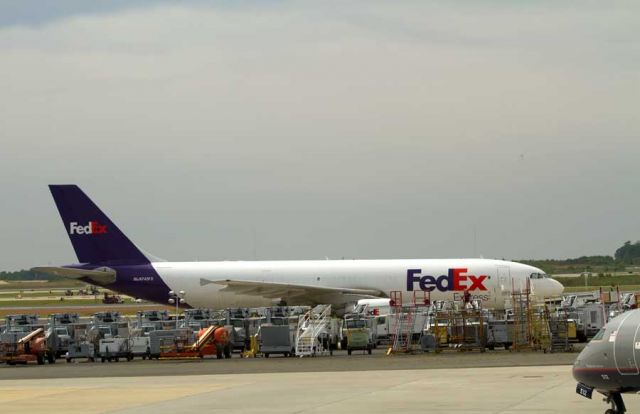 N745FD — - parked for the week end. Surrounded by a plethora of ground support equipment. Those over night letters are worth the $25 I think : )