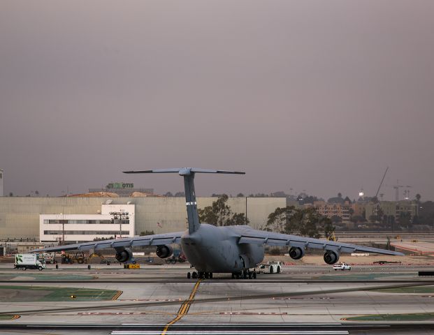 Lockheed C-5 Galaxy (N80216) - Moving a Galaxy from the freight area to remote parking. Photo taken from El Segundo overlook. Sunset, 17 Sept 2013 Los Angeles, California USA