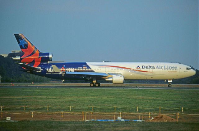 Boeing MD-11 (N812DE) - Departure at Narita Intl Airport Rwy16R on 1996/10/19 " Atlanta Olympic c/s "