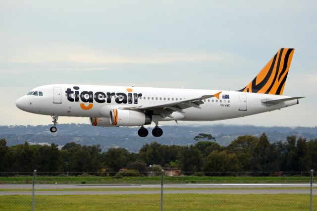 Airbus A320 (VH-VNC) - About to put down on runway 05. Thursday, 19 June 2014.