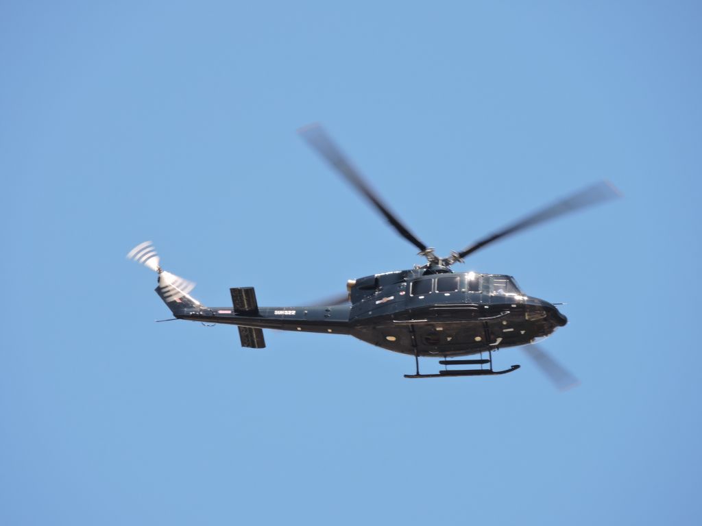 Bell VH-1 — - A Bell 212 helicopter of the Sri Lanka air force passes by.