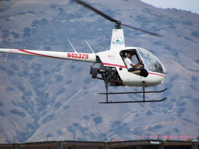 Robinson R-22 (N45329) - Lifting off from Brackett Field