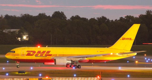 BOEING 767-200 (N657GT) - Amerijet 767-200 in the DHL yellow holding short of RWY 18L.