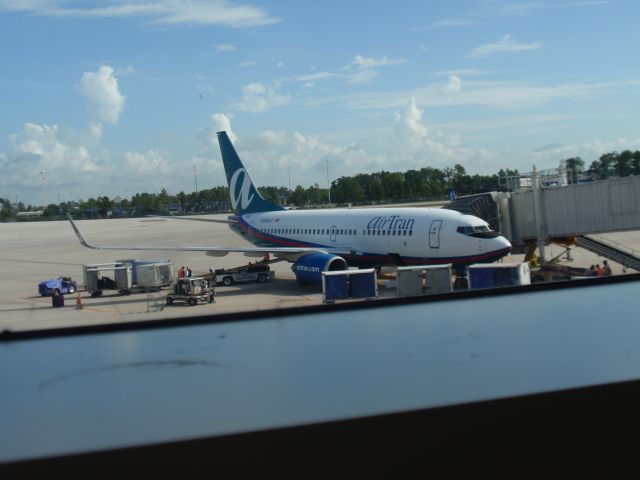 Boeing 737-700 (N290AT) - Taken from window at MCO Airport.