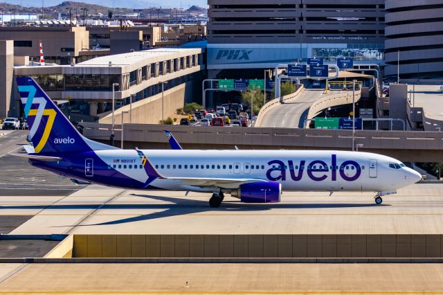 Boeing 737-800 (N801XT) - An Avelo Airlines 737-800 taxiing at PHX on 2/10/23 during the Super Bowl rush. Taken with a Canon R7 and Canon EF 100-400 II L lens.