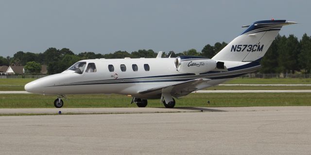 Cessna Citation CJ2+ (N573CM) - A Cessna C525 CitationJet taxiing for takeoff at Jack Edwards National Airport, Gulf Shores, AL - June 19, 2018.