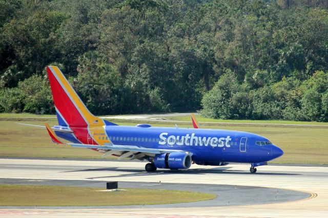 Boeing 737-700 (N405WN) - Southwest Flight 2012 arrives on Runway 1L at Tampa International Airport following flight from Milwaukee Mitchell International Airport