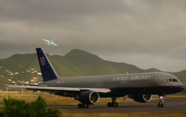 Boeing 757-200 (N588UA) - United Airlines taxi up for take off while KLM climbes the hills