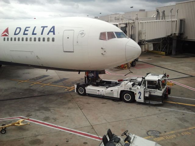 BOEING 767-300 (N156DL) - Tug pulling B767 to gate