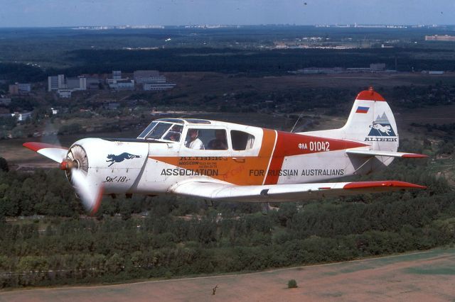 YAKOVLEV Yak-18T (ФΛΑ01042) - August 1992, we had some flights from Khodynka Aerodrome (Ходынский аэродром) and so I could made this picture of this Yakovlev Yak-18T over Moscow. My plane was an Antonov AN-2. This Airport also known as Frunze Central Aerodrome is closed now, so it has none airport codebr /br /Scan from my Kodachrome 64 slide