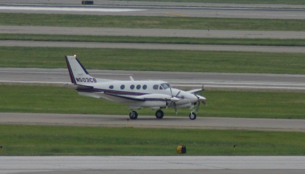 Beechcraft King Air 90 (N503CB) - Taken from the green parking garage. 
