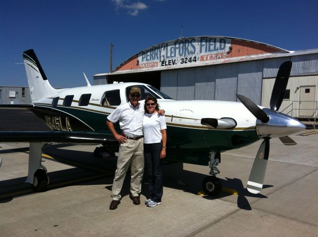 Piper Malibu Meridian (N945LA) - Mary Anne and Bill Dingus with The Green Hornet.