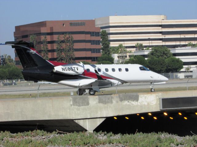 Embraer Phenom 300 (N585TV) - Taxiing to RWY 30